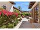 Beautiful courtyard with stone pavers, comfortable seating, and colorful flowering bushes at 4949 E Lincoln Dr # 11, Paradise Valley, AZ 85253