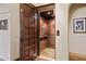 Open elevator with wood paneled interior at 4949 E Lincoln Dr # 11, Paradise Valley, AZ 85253