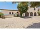 Beautiful home exterior featuring a three car garage and a large paved drive way at 4949 E Lincoln Dr # 11, Paradise Valley, AZ 85253