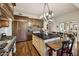 Spacious kitchen with a center island, stainless steel appliances, wood cabinets, and seating area for a modern look at 4949 E Lincoln Dr # 11, Paradise Valley, AZ 85253