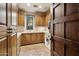 Well-organized laundry room with abundant cabinet space, a window, a utility sink, and a washer and dryer at 4949 E Lincoln Dr # 11, Paradise Valley, AZ 85253
