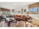 Inviting living room with a comfortable sofa, a rustic coffee table, and a view of the outside at 4949 E Lincoln Dr # 11, Paradise Valley, AZ 85253