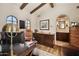Bright office features wooden beams, custom built-ins, and an ensuite bathroom at 4949 E Lincoln Dr # 11, Paradise Valley, AZ 85253