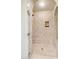 This luxurious tiled shower has a built-in seat and a convenient shelf at 4949 E Lincoln Dr # 11, Paradise Valley, AZ 85253