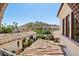 Scenic view of the terracotta rooftops and nearby mountains, framed by the architecture at 4949 E Lincoln Dr # 11, Paradise Valley, AZ 85253