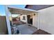 Backyard featuring a covered patio with seating and a grill, ideal for outdoor relaxation and entertaining at 5002 W Christy Dr, Glendale, AZ 85304
