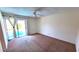 Bedroom with ceiling fan and sliding glass doors that lead to a swimming pool at 5002 W Christy Dr, Glendale, AZ 85304