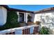 Inviting covered entry with well-maintained landscaping and decorative features at 5002 W Christy Dr, Glendale, AZ 85304