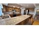Charming kitchen featuring granite countertops, stainless steel appliances, and wood cabinetry at 5002 W Christy Dr, Glendale, AZ 85304
