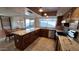 Spacious kitchen with granite countertops, stainless steel appliances, and wooden cabinets at 5002 W Christy Dr, Glendale, AZ 85304