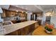 Charming kitchen featuring granite countertops, stainless steel appliances, and wood cabinetry at 5002 W Christy Dr, Glendale, AZ 85304