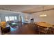 Open concept living area with wood floors and an abundance of natural light at 5002 W Christy Dr, Glendale, AZ 85304