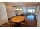 Spacious living area with hardwood floors, dining area, and plenty of room to entertain at 5002 W Christy Dr, Glendale, AZ 85304