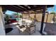 Patio with a metal shade structure and backyard pool at 5002 W Christy Dr, Glendale, AZ 85304