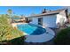 Backyard pool featuring orange landscaping at 5002 W Christy Dr, Glendale, AZ 85304