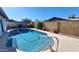 Backyard pool surrounded by a concrete patio with a view of the landscaping at 5002 W Christy Dr, Glendale, AZ 85304