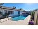 Backyard pool surrounded by a concrete patio and landscaping at 5002 W Christy Dr, Glendale, AZ 85304