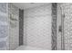 Modern shower with geometric tile, rainfall showerhead, and sleek fixtures at 519 E El Camino Dr, Phoenix, AZ 85020
