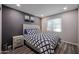 Comfortable bedroom with gray walls, and a window with blinds at 519 E El Camino Dr, Phoenix, AZ 85020
