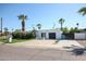 Striking modern home with desert landscaping, two-car garage and privacy wall at 519 E El Camino Dr, Phoenix, AZ 85020