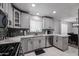 Well-appointed kitchen with stainless steel appliances, elegant countertops, and a view to the dining area at 519 E El Camino Dr, Phoenix, AZ 85020