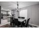 Open concept with a modern light fixture and spacious seating to enjoy casual dining and conversation at 519 E El Camino Dr, Phoenix, AZ 85020