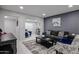 Cozy living room featuring tile floors, recessed lighting, and stylish, modern decor and furniture at 519 E El Camino Dr, Phoenix, AZ 85020