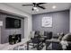 Cozy living room featuring a modern design, comfortable seating, and a stylish entertainment center at 519 E El Camino Dr, Phoenix, AZ 85020