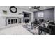 Bright living area featuring a decorative fireplace, modern furniture, and stylish accents at 519 E El Camino Dr, Phoenix, AZ 85020