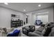 An open living space with marble tile flooring, a large sofa, and a view to another room at 519 E El Camino Dr, Phoenix, AZ 85020