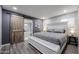 Serene bedroom with a sliding barn door to the bathroom, creating a relaxing private retreat at 519 E El Camino Dr, Phoenix, AZ 85020