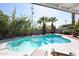Outdoor swimming pool surrounded by landscaping and a sunny sky at 519 E El Camino Dr, Phoenix, AZ 85020