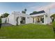 Stylish backyard showcasing a manicured lawn, a covered patio, and contemporary architectural design at 5318 N 24Th Pl, Phoenix, AZ 85016