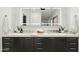 Beautiful bathroom with marble countertops, dual sinks, and illuminated mirrors for a modern and luxurious feel at 5318 N 24Th Pl, Phoenix, AZ 85016