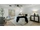 Calm bedroom with a ceiling fan, accent painting, and neutral tones at 5318 N 24Th Pl, Phoenix, AZ 85016