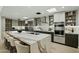 Sleek kitchen with a large island, modern appliances, and open shelving, seamlessly blending style and functionality at 5318 N 24Th Pl, Phoenix, AZ 85016