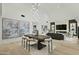 Inviting living and dining space with vaulted ceilings, a modern chandelier, and stylish decor for a comfortable and chic ambiance at 5318 N 24Th Pl, Phoenix, AZ 85016
