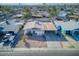 Aerial shot of house with attached carport in neighborhood featuring a minimal desert landscape at 5407 W Cambridge Ave, Phoenix, AZ 85035