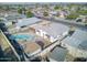 Aerial view of the home showcasing a pool, covered patio, and surrounding neighborhood at 5407 W Cambridge Ave, Phoenix, AZ 85035