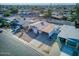 Aerial shot of residence showcasing attached carport, xeriscape front yard, street and neighborhood view at 5407 W Cambridge Ave, Phoenix, AZ 85035