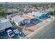 Aerial shot of home with carport, minimal landscaping and street view in neighborhood at 5407 W Cambridge Ave, Phoenix, AZ 85035