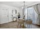 Bright dining area featuring a modern table set and elegant lighting at 5407 W Cambridge Ave, Phoenix, AZ 85035