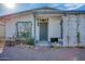 Inviting front entrance with decorative iron door and lattice privacy screen at 5407 W Cambridge Ave, Phoenix, AZ 85035