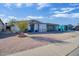 Front exterior view with a desert landscaped yard, and attached carport at 5407 W Cambridge Ave, Phoenix, AZ 85035