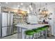Modern kitchen with stainless steel appliances, ample storage, and open shelving at 5407 W Cambridge Ave, Phoenix, AZ 85035