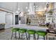 Open kitchen with a large island, modern appliances, and stylish pendant lighting, perfect for entertaining at 5407 W Cambridge Ave, Phoenix, AZ 85035