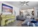 Open living room with stylish piano and comfortable seating, flowing into the adjacent kitchen at 5407 W Cambridge Ave, Phoenix, AZ 85035