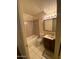 Bathroom features a vanity with sink, toilet, bathtub and shower at 5929 N 48Th Ave, Glendale, AZ 85301
