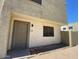 Charming townhome with a stucco exterior, sidewalk, and well maintained gravel yard at 5929 N 48Th Ave, Glendale, AZ 85301
