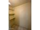 Walk-in pantry with tile floors and three shelves for storage at 5929 N 48Th Ave, Glendale, AZ 85301